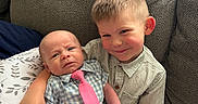 Jaxon joined the competition — help win amazing prizes! baby, child, couch, cushion, cute, fabric, family, happy, indoor, infant, love, person, plaid_shirt, portrait, sibling, sitting, smile, sock, tie, young_child