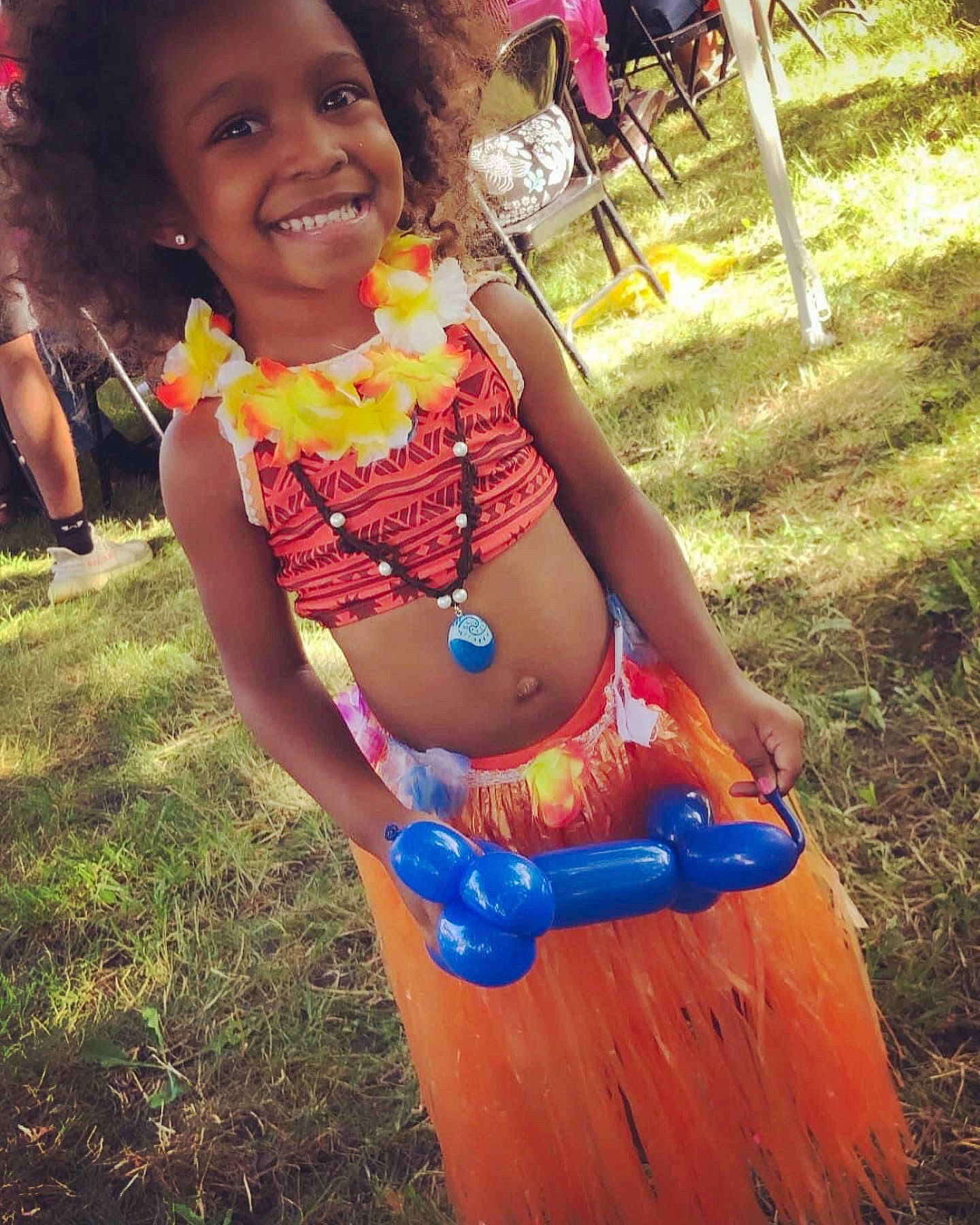 Paityn joined the competition — help win amazing prizes! abdomen, chest, child, electric_blue, face, fun, grass, happy, human_leg, joy, knee, leisure, person, plant, recreation, sitting, smile, swimwear, thigh, toddler