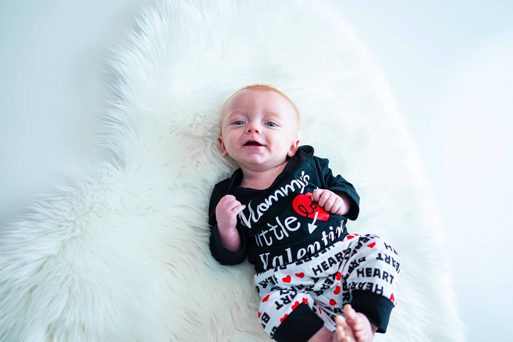 Ashton is registered to the contest to win money with this photo: baby, baby_toddler_clothing, child, child_model, flash_photography, fun, fur, happy, iris, magenta, pattern, person, photo_shoot, portrait, portrait_photography, sitting, sleeve, t_shirt, toddler