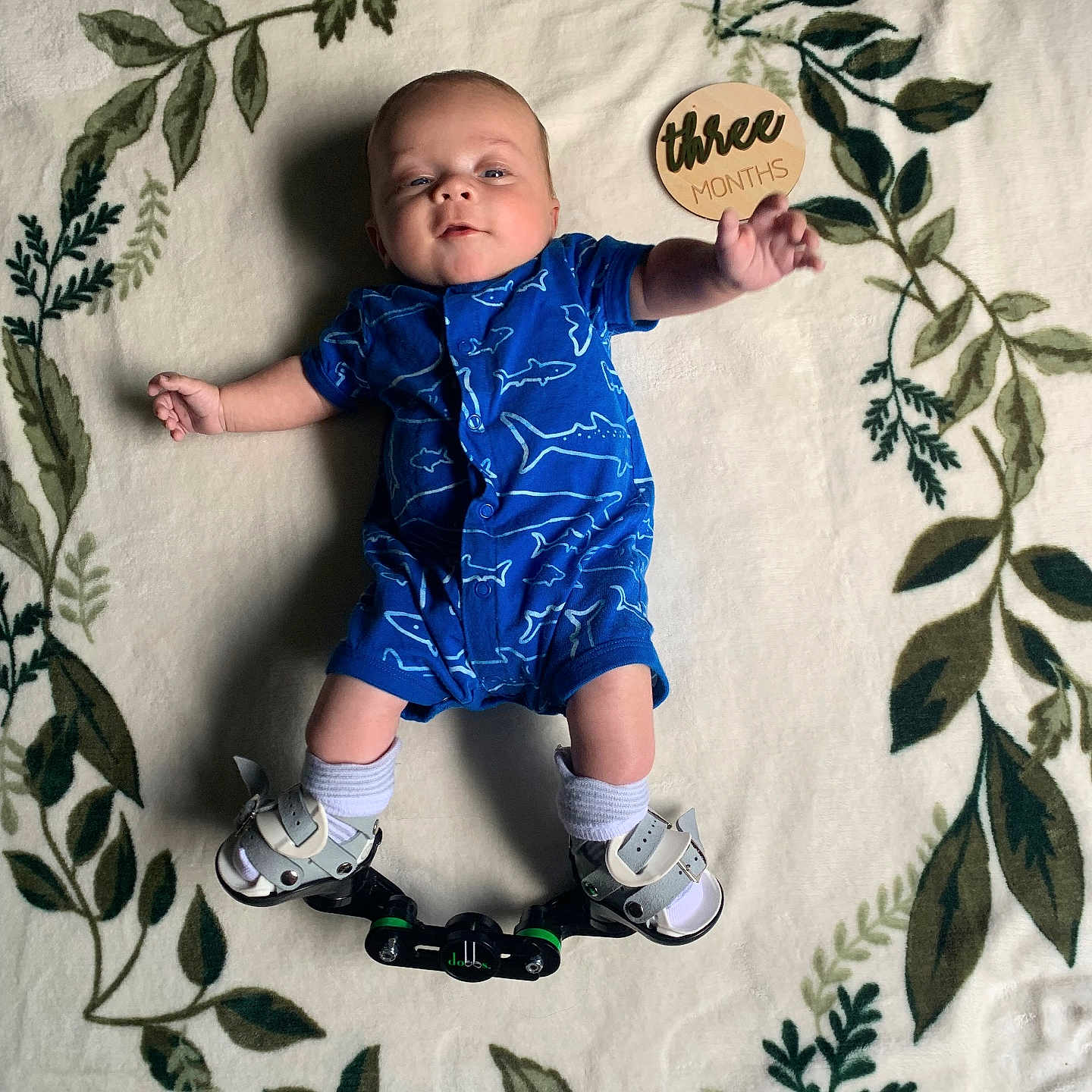 Michael is registered to the contest to win money with this photo: baby, bed, clothing, cushion, face, footwear, furniture, head, homedecor, pants, person, photography, portrait, quilt, sandal, shoe, shorts, sitting, t_shirt, text
