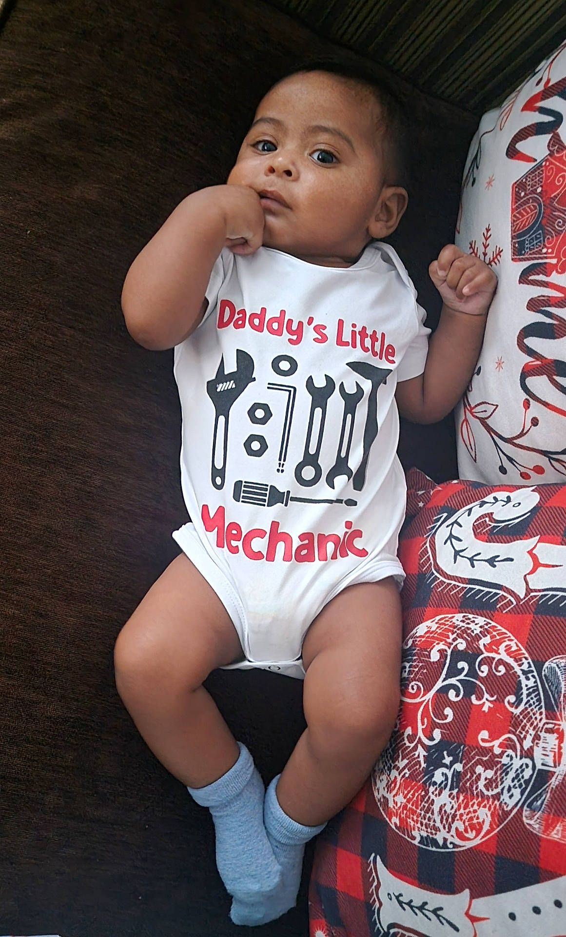 Nathaniel is registered to the contest to win money with this photo: baby, bodypart, clothing, couch, cushion, face, finger, footwear, furniture, head, homedecor, hosiery, person, photography, portrait, shoe, shorts, sitting, sock, t_shirt