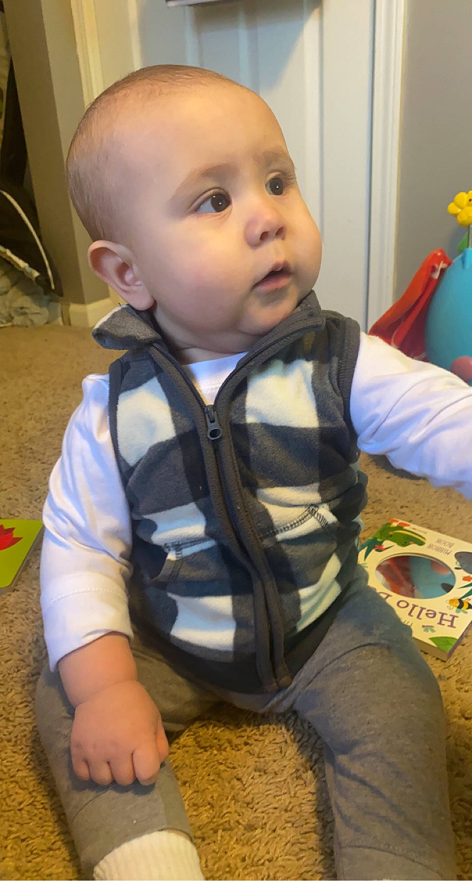 Kaydan is registered to the contest to win money with this photo: baby, baby_toddler_clothing, cheek, child, electric_blue, flooring, fun, hairstyle, happy, head, iris, nose, person, play, sitting, skin, sleeve, soil, standing, toddler