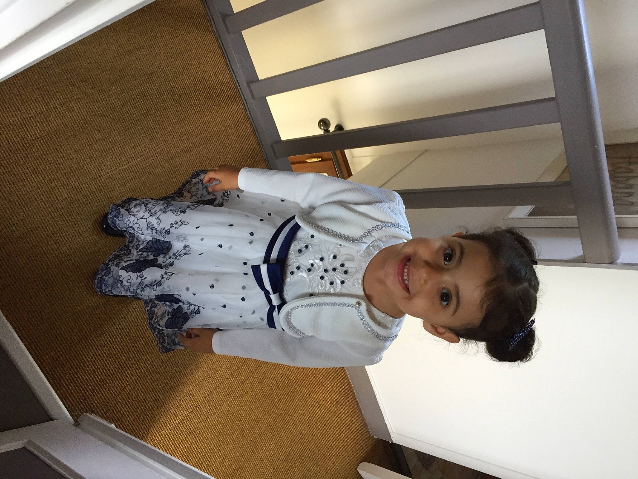 Lana participe au concours pour gagner de l'argent avec cette photo : baby, baby_products, baby_toddler_clothing, ceiling, cleanliness, comfort, daylighting, door, elbow, flooring, hat, joy, person, room, sleeve, smile, stairs, toddler