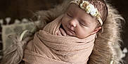 Luana participe au concours pour gagner de l'argent avec cette photo : baby, blanket, child, closeup, cozy, cushion, cute, floral, headband, indoors, infant, newborn, peaceful, portrait, resting, sleeping, soft, toddler, warm, wrapped