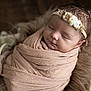 Luana participe au concours pour gagner de l'argent avec cette photo : newborn, baby, sleeping, wrapped, blanket, headband, floral, soft, cozy, cushion, closeup, portrait, peaceful, infant, cute, indoors, warm, resting, child, toddler