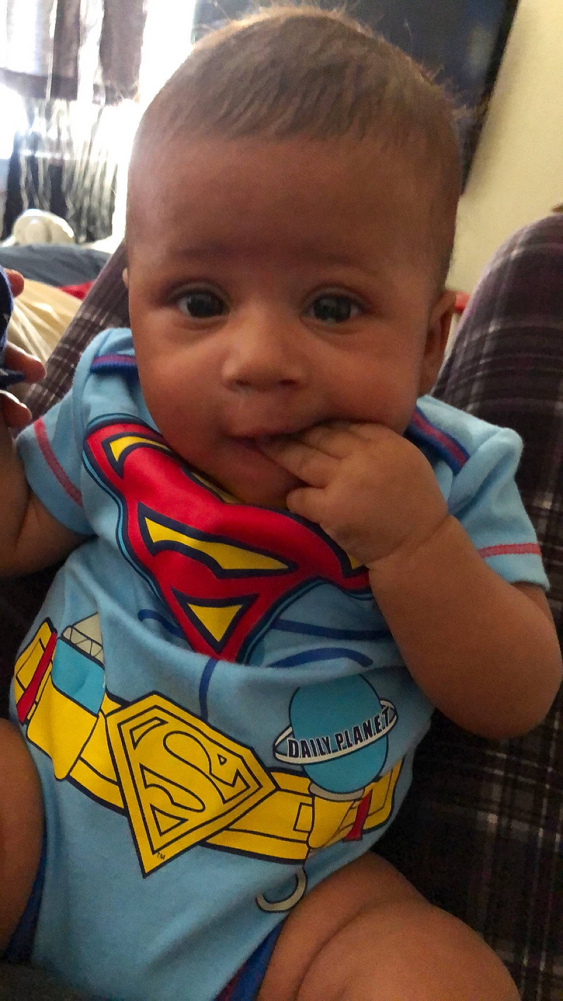Jakobe is registered to the contest to win money with this photo: baby, cheek, child, cool, eye, face, fictional_character, forehead, fun, head, justice_league, lip, mouth, neck, person, skin, smile, superhero, superman, toddler