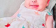 Sierra joined the competition — help win amazing prizes! arm, baby, child, closeup, cute, dress, eyes, face, happy, head, infant, laying, light, person, portrait, skin, smile, soft_surface, star_pattern, young