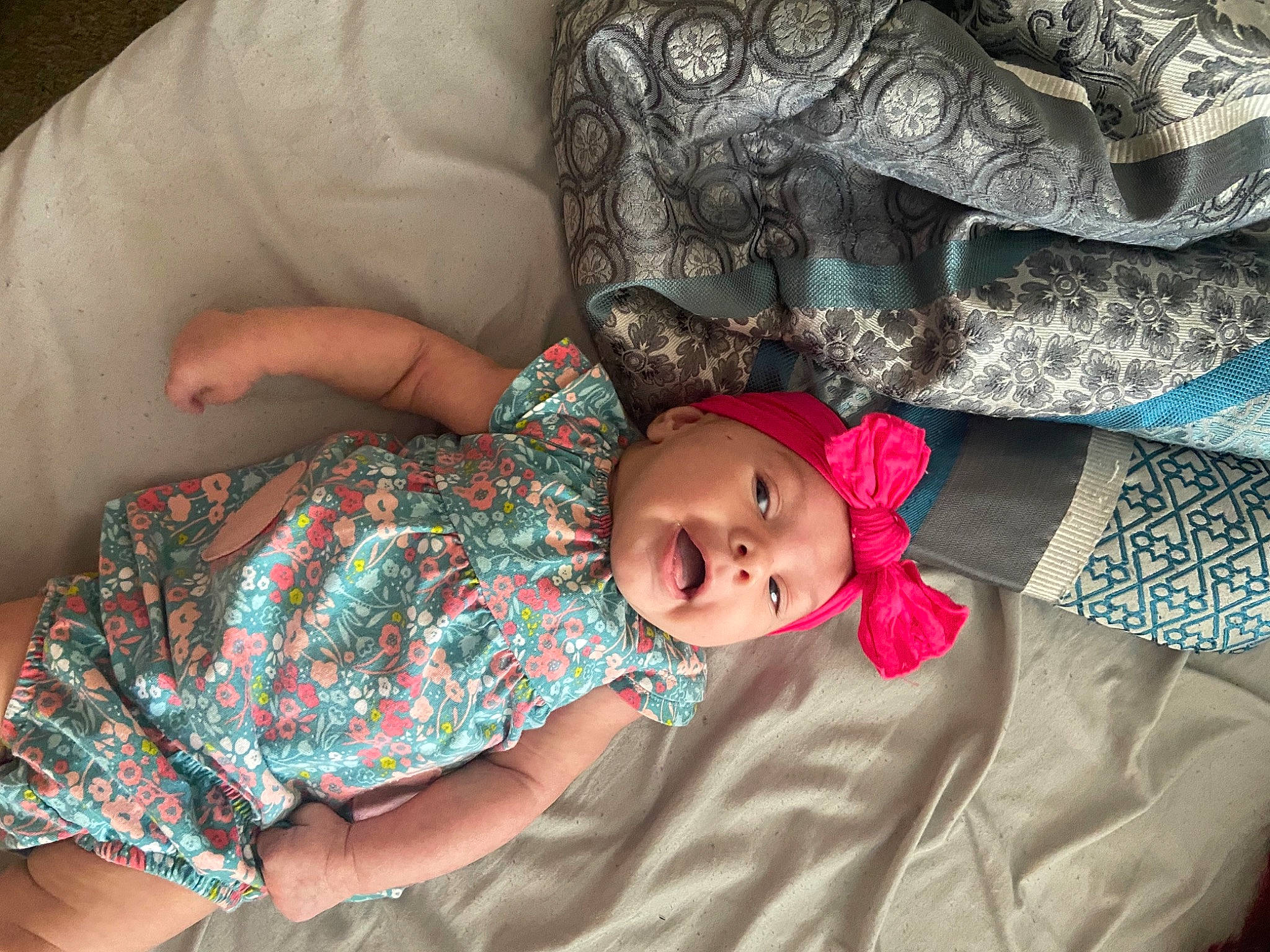 Meelah is registered to the contest to win money with this photo: arm, baby, baby_toddler_clothing, cheek, comfort, couch, eye, facial_expression, finger, hand, head, headwear, human_body, linens, mammal, mouth, person, product, skin, textile