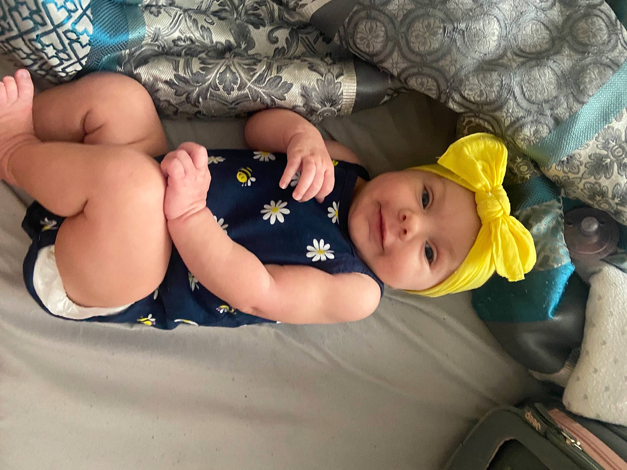 Meelah is registered to the contest to win money with this photo: baby, baby_sleeping, baby_toddler_clothing, beauty, child, comfort, couch, eye, foot, fun, headwear, human_body, knee, lap, leg, linens, mouth, person, skin, thigh