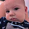 Noah participe au concours pour gagner de l'argent avec cette photo : baby, closeup, face, infant, child, portrait, striped_clothing, animal_design, cute, serious_expression, indoor, soft_light, young_child, person, head, eyebrows, skin, hair, eyes, nose