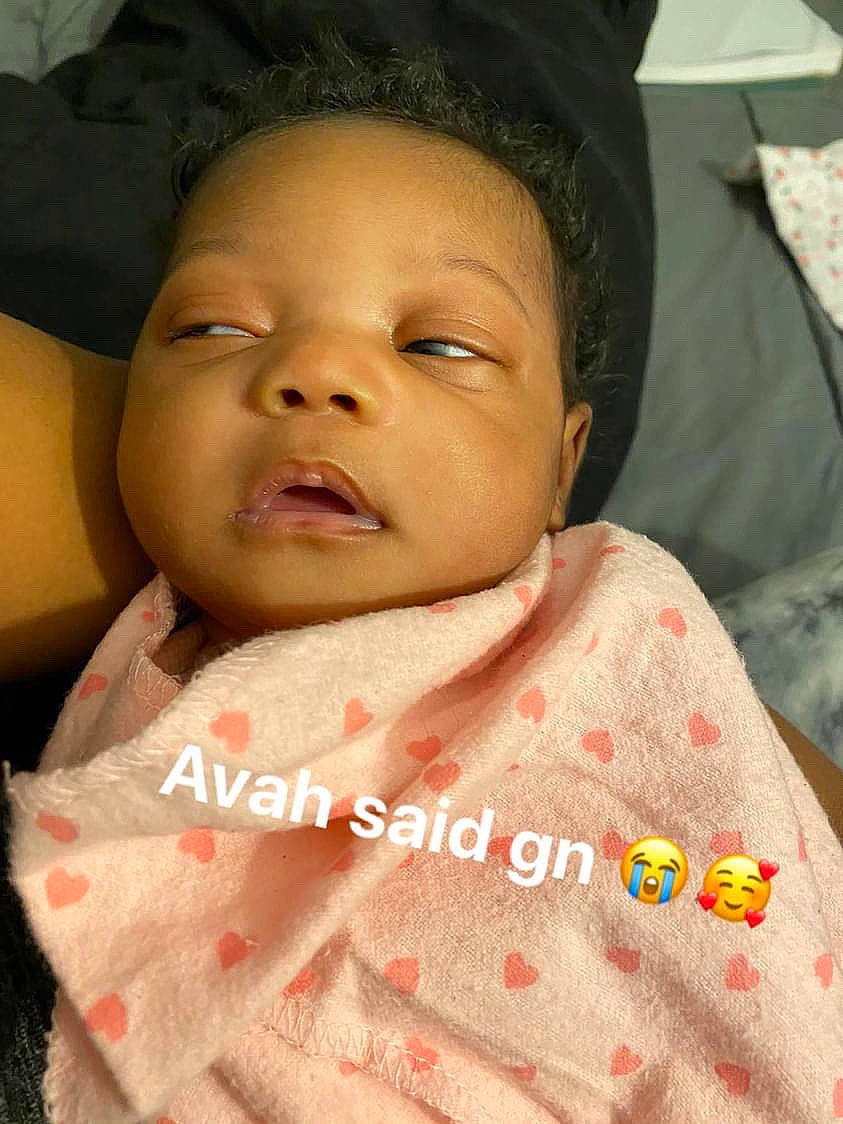 Avah is registered to the contest to win money with this photo: baby, baby_toddler_clothing, cheek, chin, collar, comfort, eyebrow, eyelash, gesture, happy, linens, lip, mouth, neck, nose, person, skin, sleeve, smile, textile