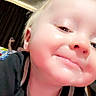 Maximus is registered to the contest to win money with this photo: child, close_up, selfie, face, smiling, happy, portrait, indoor, hoodie, clothing, blonde_hair, fair_skin, eyes, nose, mouth, head, person, casual, camera, playful