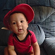 Zeremiah joined the competition — help win amazing prizes! armchair, baby, blue_gray_furniture, casual, child, clothing, comfortable, curious, expression, face, headwear, home, indoor, infant, person, portrait, red_cap, red_shirt, sitting, young_child