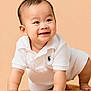 Rei is registered to the contest to win money with this photo: baby, crawling, smiling, white_clothing, polo_shirt, infant, child, cute, happy, skin, face, hands, legs, indoor, portrait, young_child, adorable, peach_background, soft_texture, expression