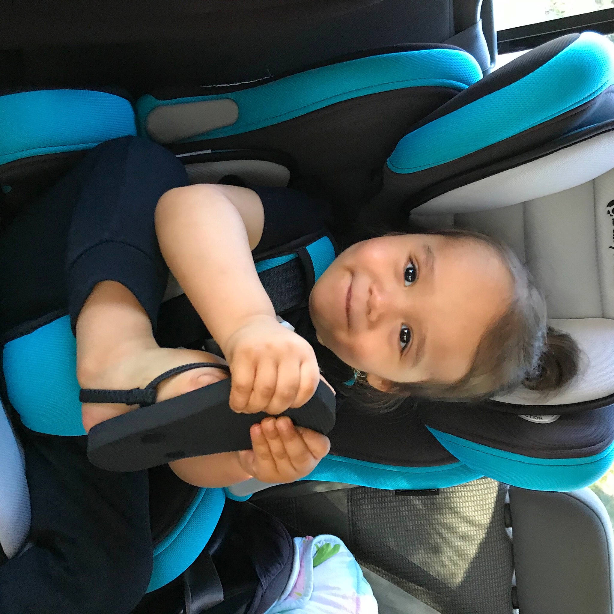 Gannon is registered to the contest to win money with this photo: aqua, azure, baby, baby_carriage, baby_in_car_seat, baby_products, baby_toddler_clothing, car_seat, car_seat_cover, child, comfort, head_restraint, joy, lap, person, product, seat_belt, service, teal, toddler