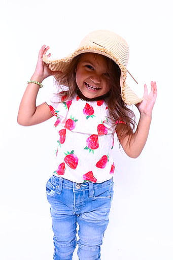 Kinsley Reyes is registered to the contest to win money with this photo: child, child_model, clothing, girl, hat, headgear, headwear, jeans, joint, joy, pattern, person, shoulder, sleeve, smile, sun_hat, t_shirt, toddler