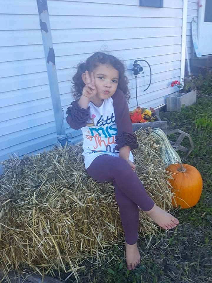 Izzy is registered to the contest to win money with this photo: blond, boot, calabaza, cucurbita, door, electric_blue, fun, gourd, grass, human_leg, knee, long_hair, people_in_nature, person, plant, pumpkin, soil, t_shirt, thigh, window