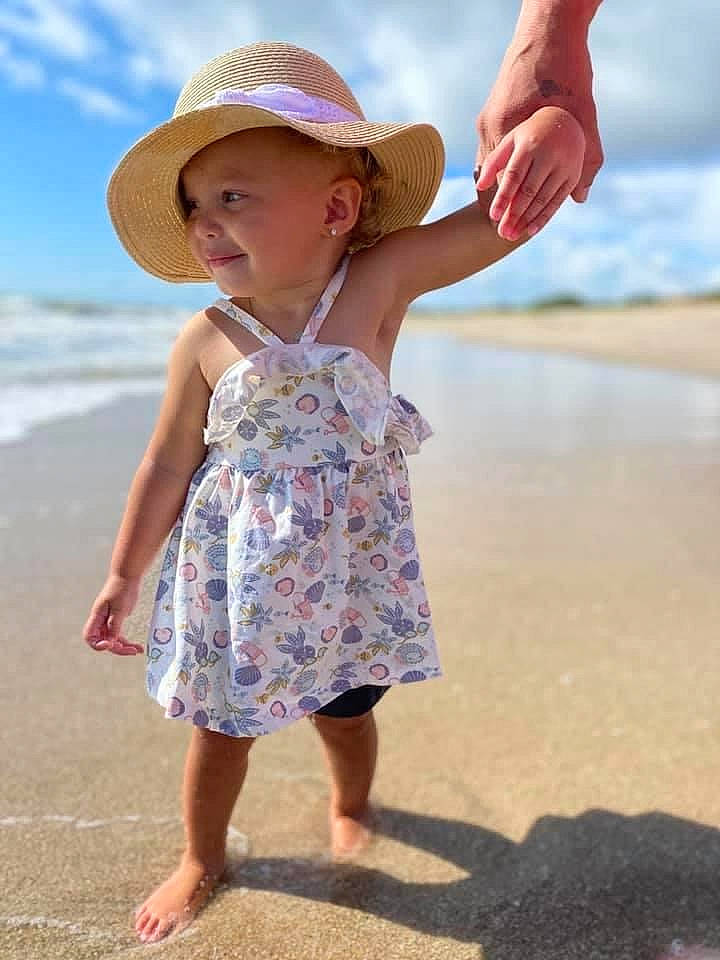Kenzlee joined the competition — help win amazing prizes! barefoot, beach, child, dress, fashion_accessory, finger, fun, hat, headgear, headwear, pattern, person, play, sand, smile, summer, sun_hat, toddler, vacation