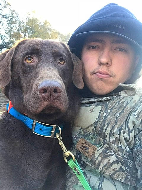 Steel joined the competition — help win amazing prizes! beard, canidae, cap, carnivore, collar, companion_dog, dog, dog_breed, dog_collar, fur, gun_dog, liver, military_camouflage, personal_protective_equipment, sky, snout, sporting_group, tree, vertebrate, working_animal