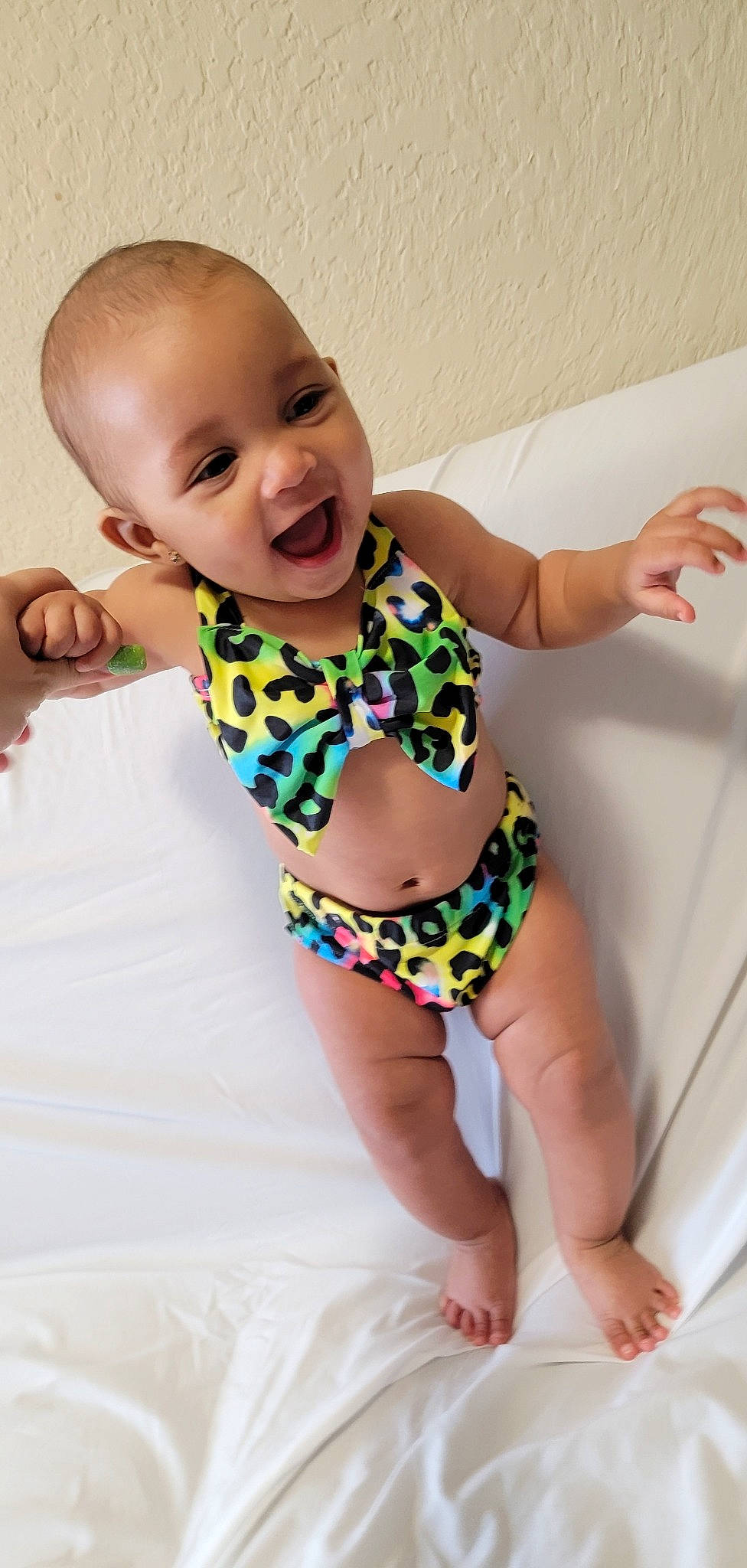 Draya is registered to the contest to win money with this photo: arm, baby_toddler_clothing, chest, finger, hand, happy, human_body, joint, leg, neck, person, pink, shoulder, skin, smile, stomach, swimwear, thigh, thumb, trunk
