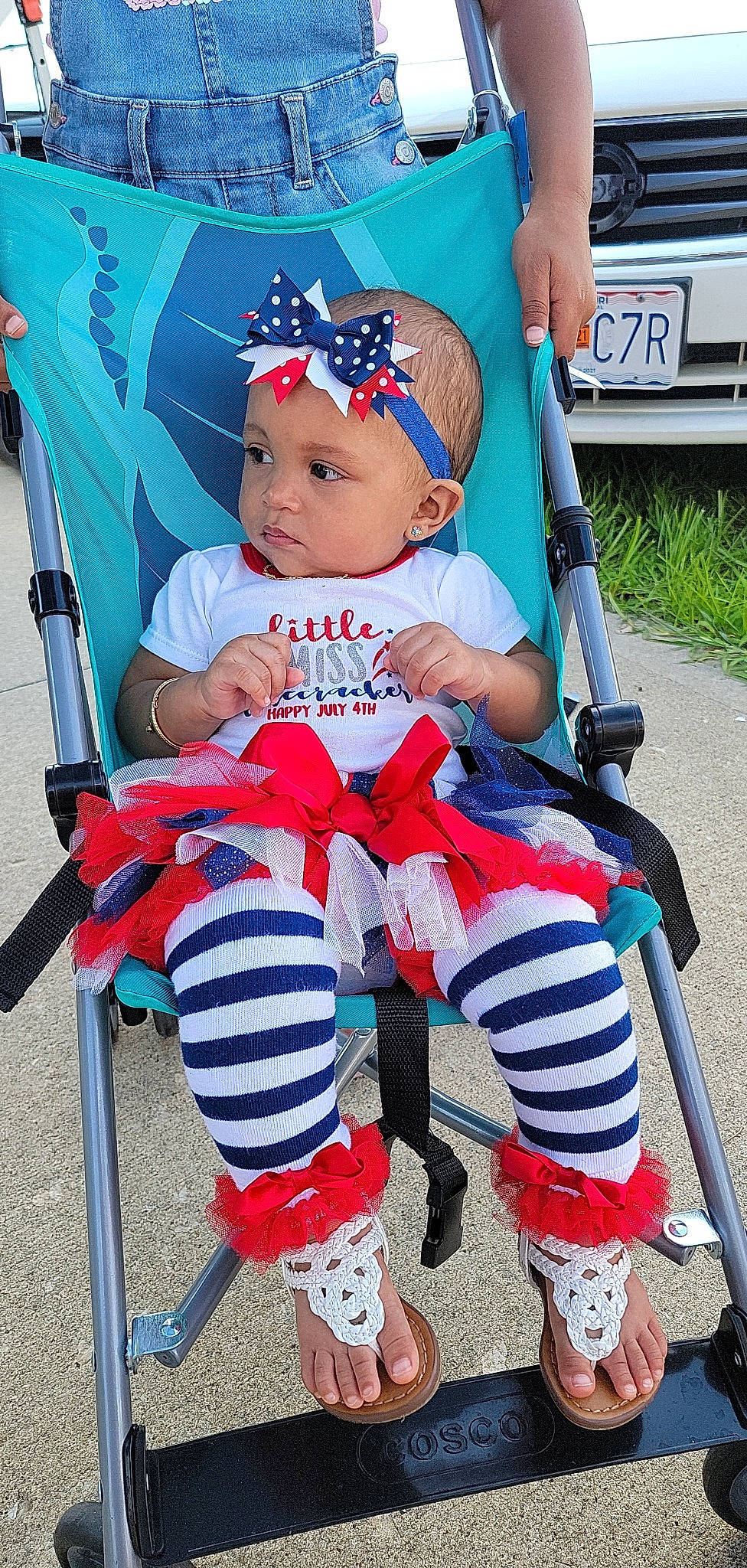 Draya is registered to the contest to win money with this photo: baby, baby_carriage, baby_toddler_clothing, blue, cap, child, electric_blue, face, fun, hat, headwear, lap, person, photograph, plant, snapshot, sneakers, tire, toddler, vehicle