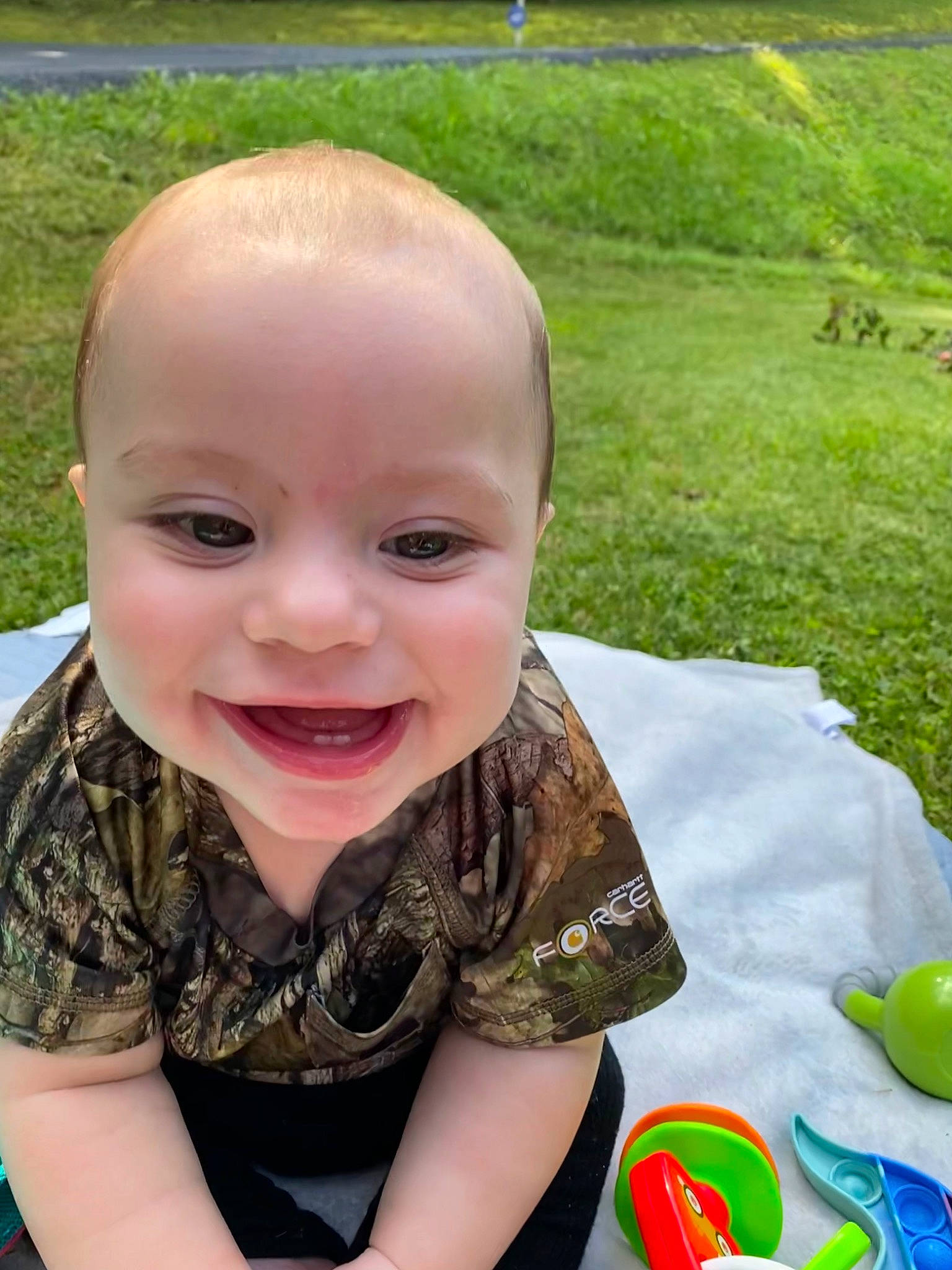 Stratton joined the competition — help win amazing prizes! baby, baby_laughing, baby_toddler_clothing, child, facial_expression, finger, fun, grass, green, happy, joy, lawn, leisure, nose, people_in_nature, person, play, recreation, sitting, smile