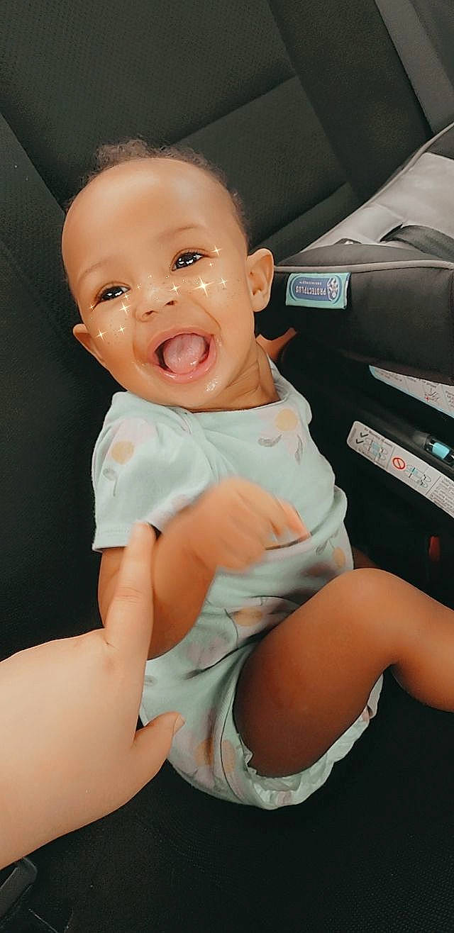 Camila joined the competition — help win amazing prizes! baby, baby_products, baby_toddler_clothing, car_seat, comfort, elbow, gesture, happy, human_leg, knee, leg, mouth, nail, person, skin, smile, t_shirt, thigh, thumb, toddler