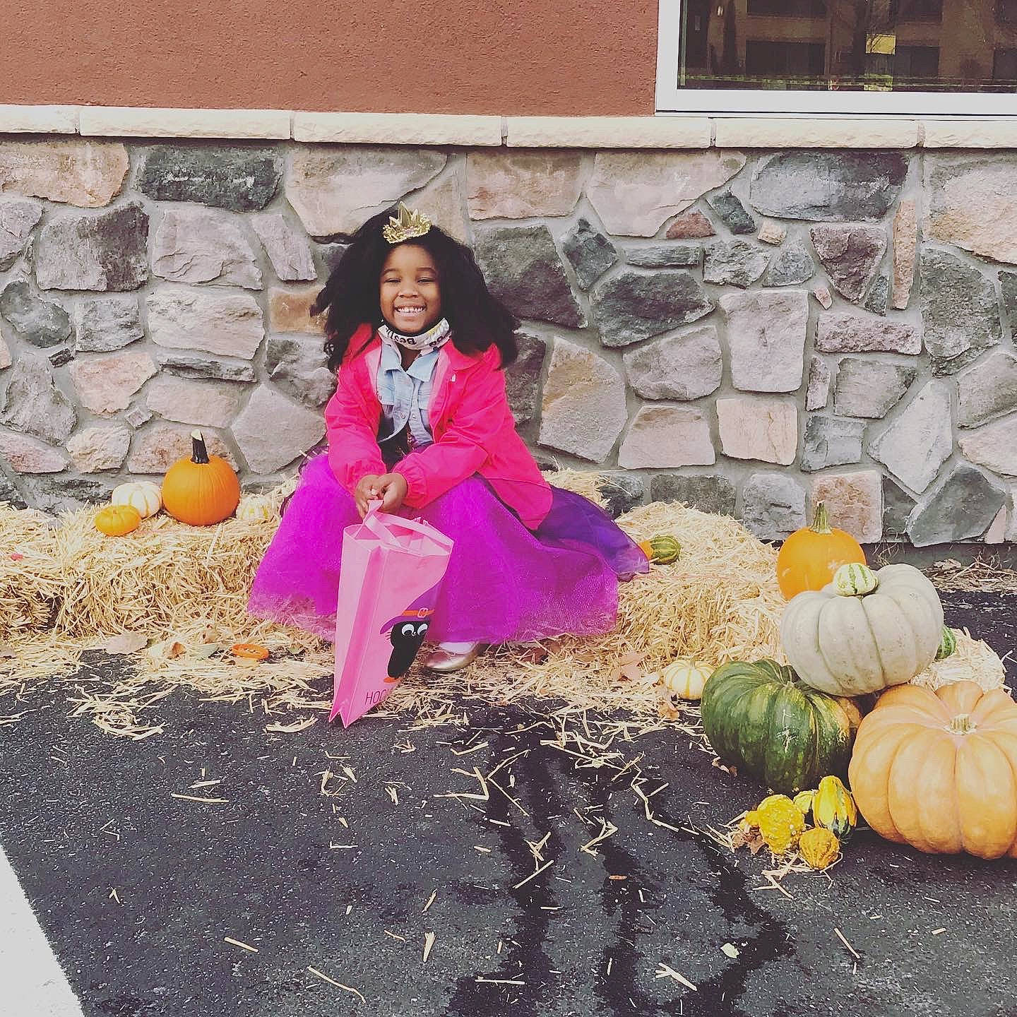 Kyrah joined the competition — help win amazing prizes! calabaza, cucurbita, fruit, fun, gourd, grass, happy, joy, leisure, natural_foods, person, plant, pumpkin, sitting, smile, soil, squash, tradition, vegetable, whole_food