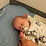 Cameron joined the competition — help win amazing prizes! baby, infant, pacifier, hand, finger, blanket, knit, bed, sleeping, clothing, penguin, cute, cozy, comfort, child, newborn, person, soft, resting, indoor