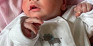 Cameron joined the competition — help win amazing prizes! newborn, baby, infant, person, clothing, onesie, hand, face, skin, pink_shirt, animal_print, cute, cozy, soft, portrait, holding, closeup, expression, small_hand, newborn_clothing