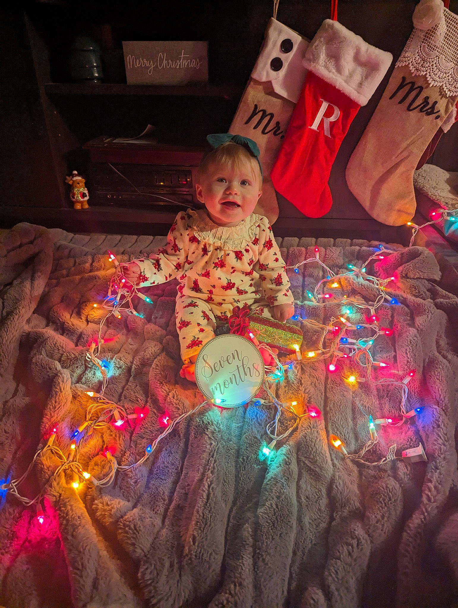 Remi joined the competition — help win amazing prizes! baby, christmas, christmas_ornament, darkness, event, fun, hat, holiday, linens, magenta, person, pink, purple, room, sitting, space, textile, toddler, toy, tradition