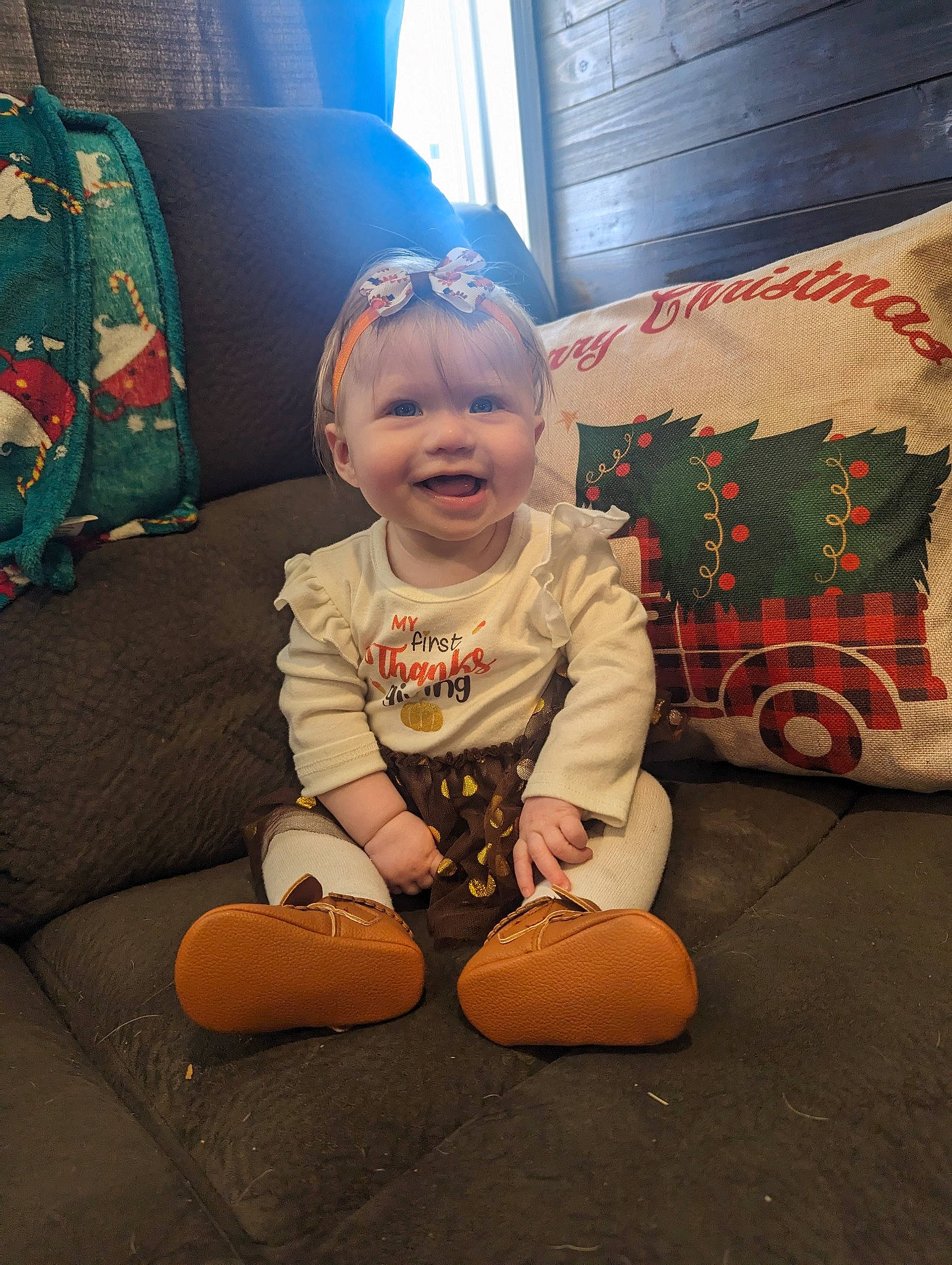 Remi joined the competition — help win amazing prizes! baby, baby_toddler_clothing, child, comfort, couch, curtain, flooring, fun, happy, head, joy, lap, living_room, person, room, sitting, sleeve, smile, t_shirt, toddler