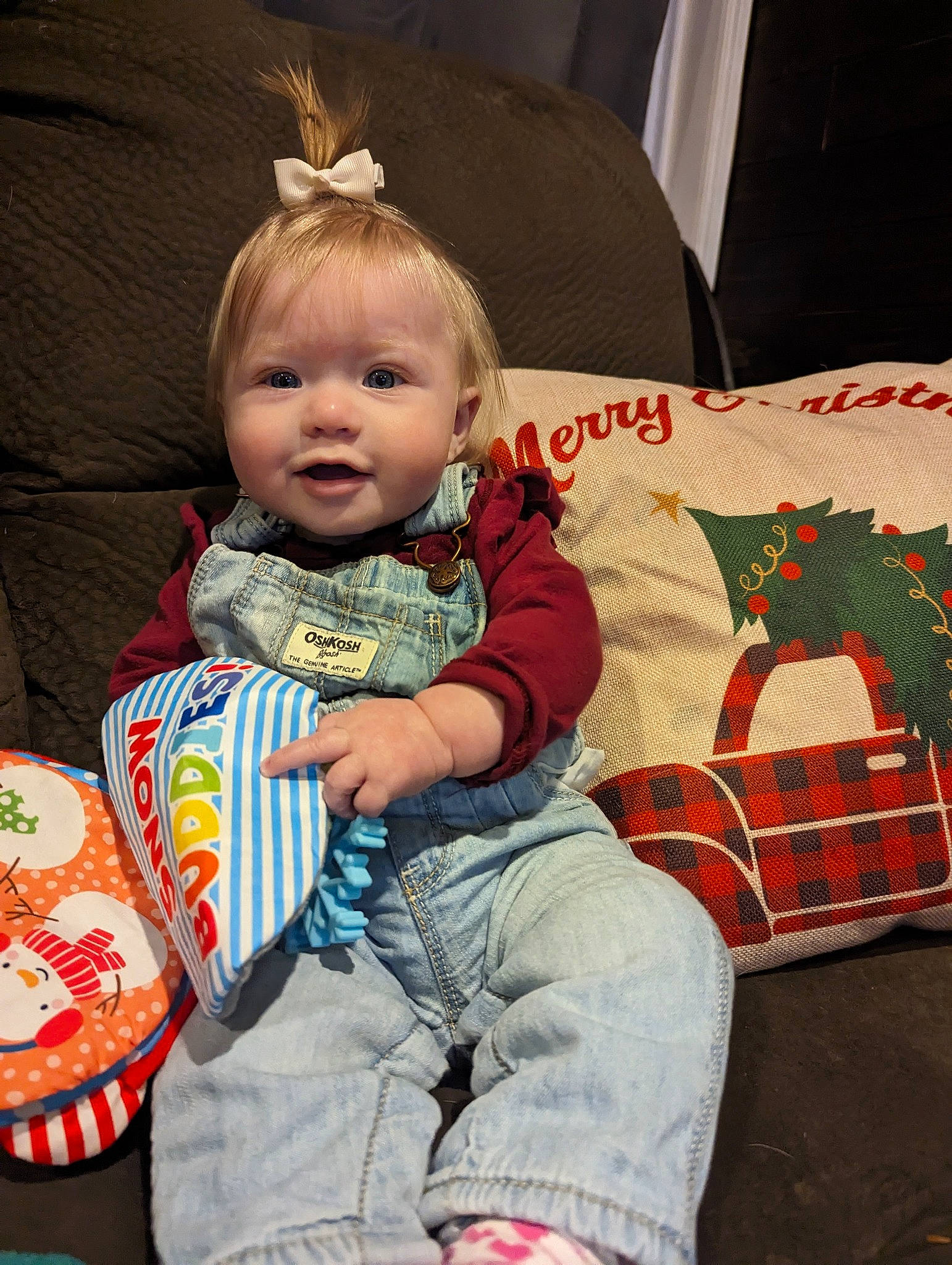 Remi joined the competition — help win amazing prizes! arm, baby, baby_toddler_clothing, cheek, christmas, comfort, event, eye, face, fun, happy, head, holiday, human_body, lap, linens, person, sitting, sleeve, smile