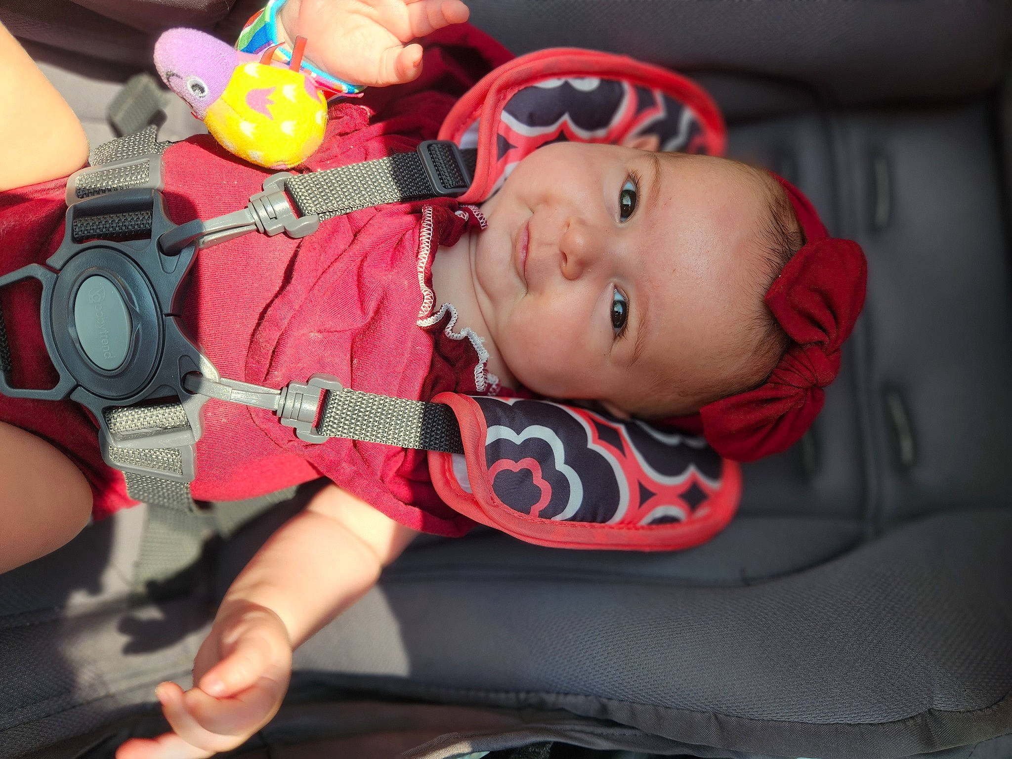 Raina is registered to the contest to win money with this photo: baby, baby_carriage, baby_products, baby_toddler_clothing, car_seat, carmine, cheek, child, comfort, finger, fun, hand, happy, mouth, nail, person, skin, smile, thumb, toddler