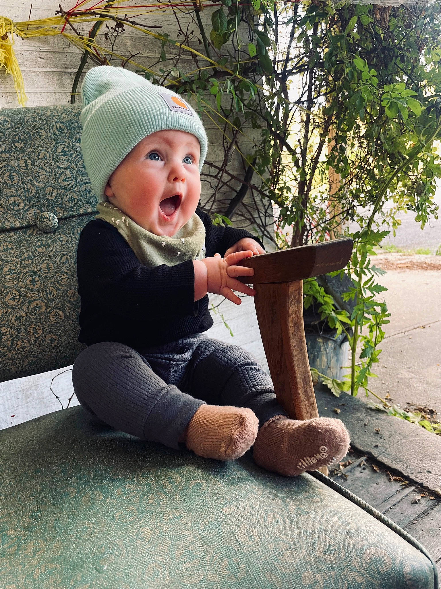 Dylan joined the competition — help win amazing prizes! cap, child, foot, fun, grass, hat, headgear, headwear, human_leg, knee, leg, leisure, person, plant, recreation, road_surface, sidewalk, sitting, sun_hat, surprise