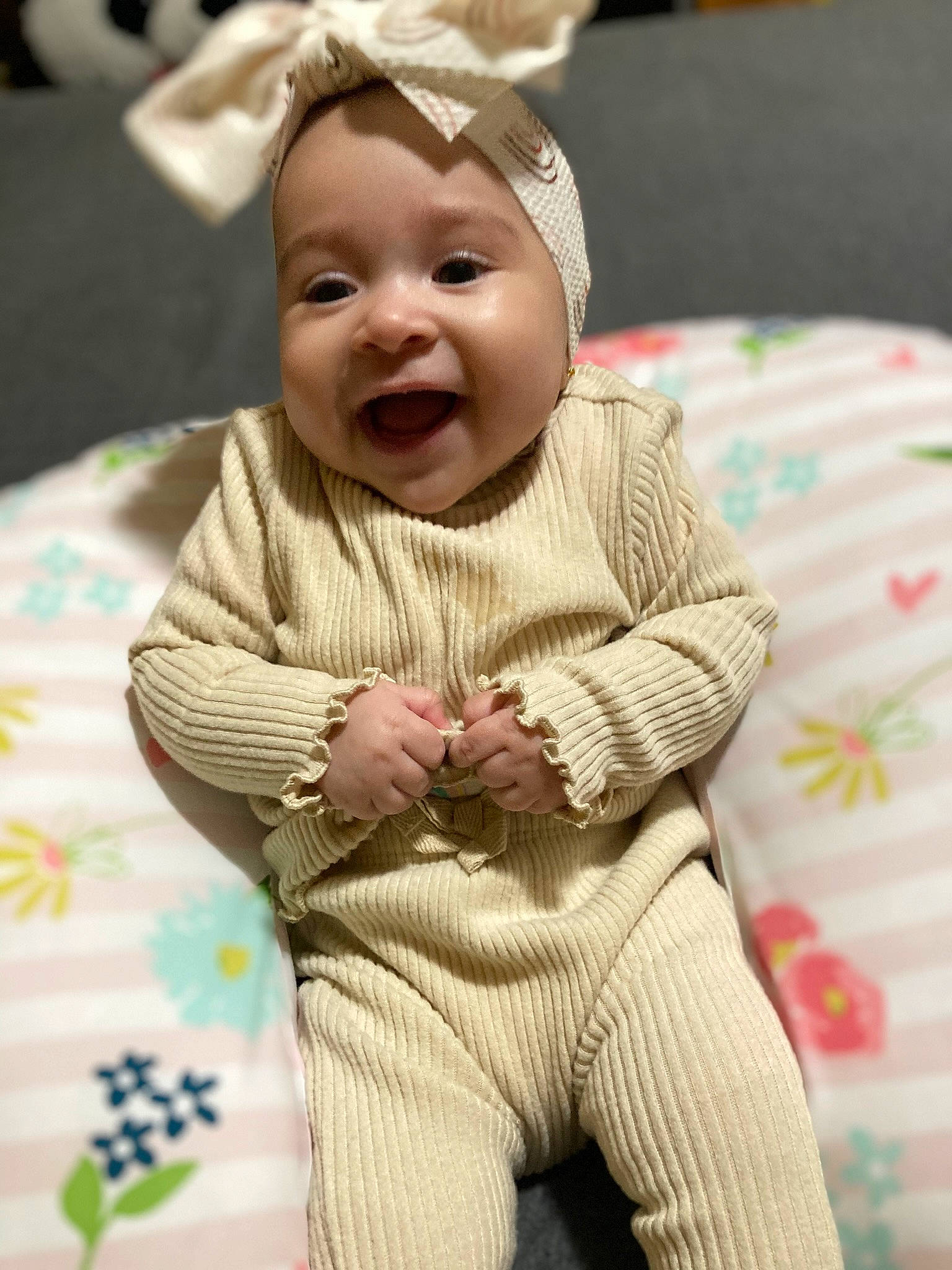 Kaylani joined the competition — help win amazing prizes! baby, baby_laughing, baby_toddler_clothing, child, comfort, event, eye, face, facial_expression, fun, happy, head, headgear, headwear, human_body, person, pink, skin, sleeve, smile