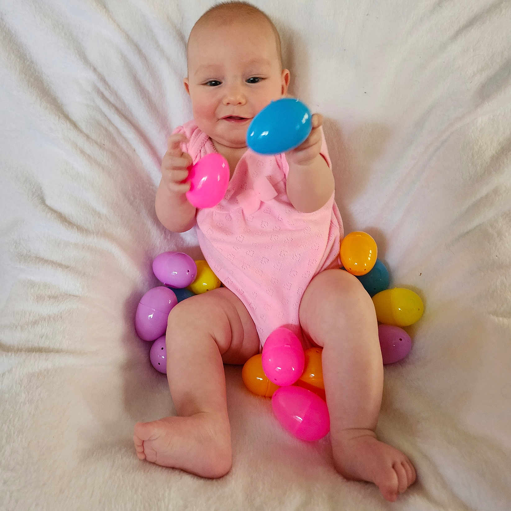 Raena is registered to the contest to win money with this photo: baby, balloon, bed, bodypart, couch, face, finger, furniture, hand, head, indoors, medication, newborn, person, photography, pill, portrait, sitting, sphere, toy