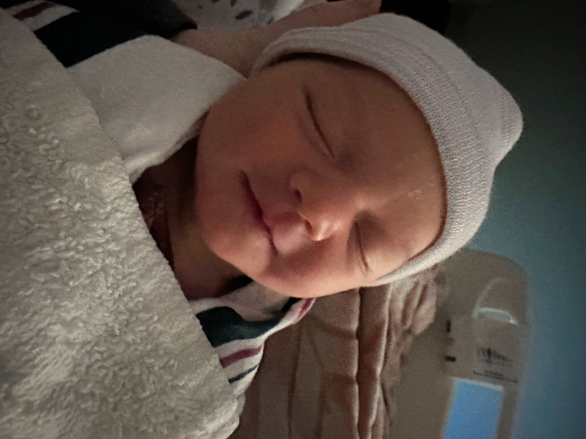 Sophie is registered to the contest to win money with this photo: baby, baby_products, baby_toddler_clothing, bedtime, cap, cheek, child, comfort, fashion_accessory, happy, iris, laugh, linens, lip, nap, nose, person, portrait_photography, sleeve, smile