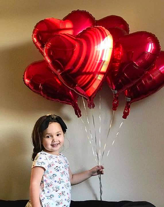 Athena is registered to the contest to win money with this photo: balloon, happy, heart, joy, love, party_supply, person, red, smile, valentines_day