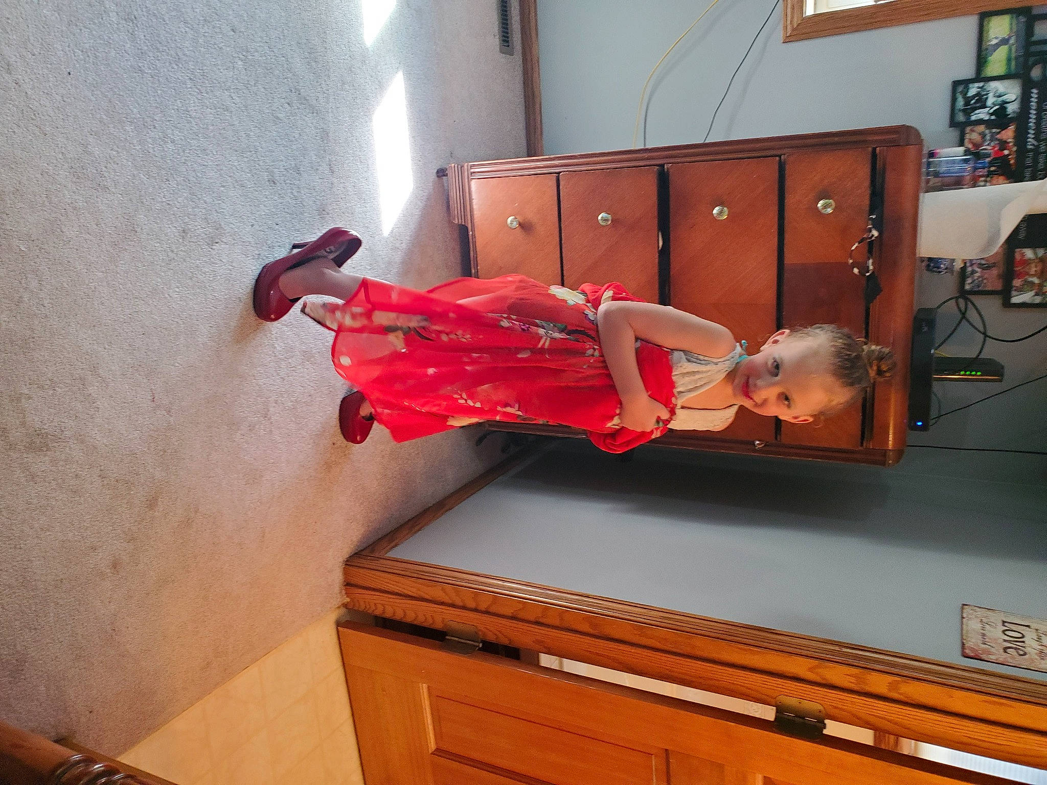 Kaylynn joined the competition — help win amazing prizes! cabinetry, chest_of_drawers, comfort, cupboard, drawer, dress, eyewear, floor, flooring, furniture, hardwood, human_leg, joy, kitchen, orange, person, room, sandal, table, textile