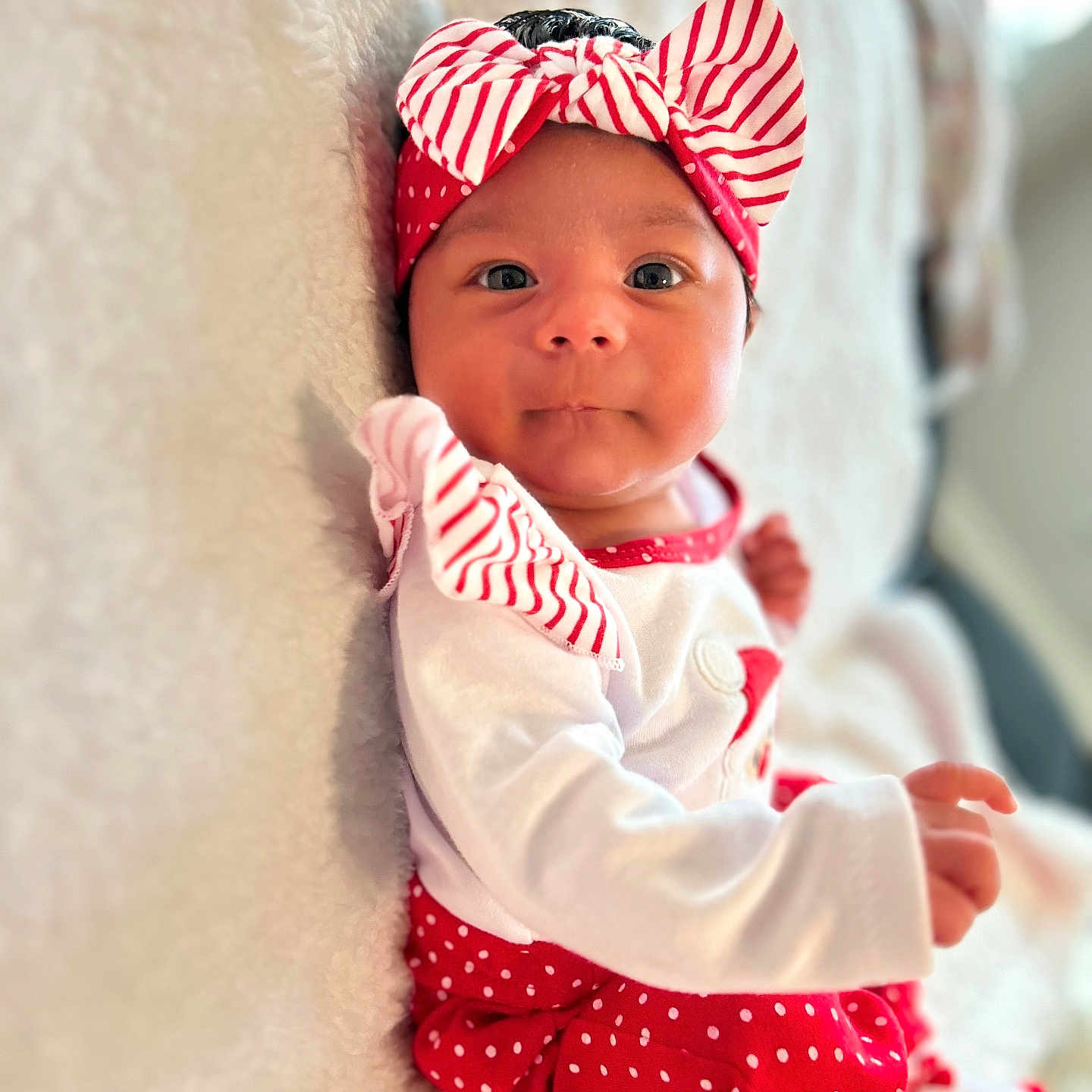 Octavia is registered to the contest to win money with this photo: accessories, baby, blanket, bodypart, bonnet, cap, clothing, face, finger, hand, happy, hat, head, headband, newborn, person, photography, portrait, quilt, smile