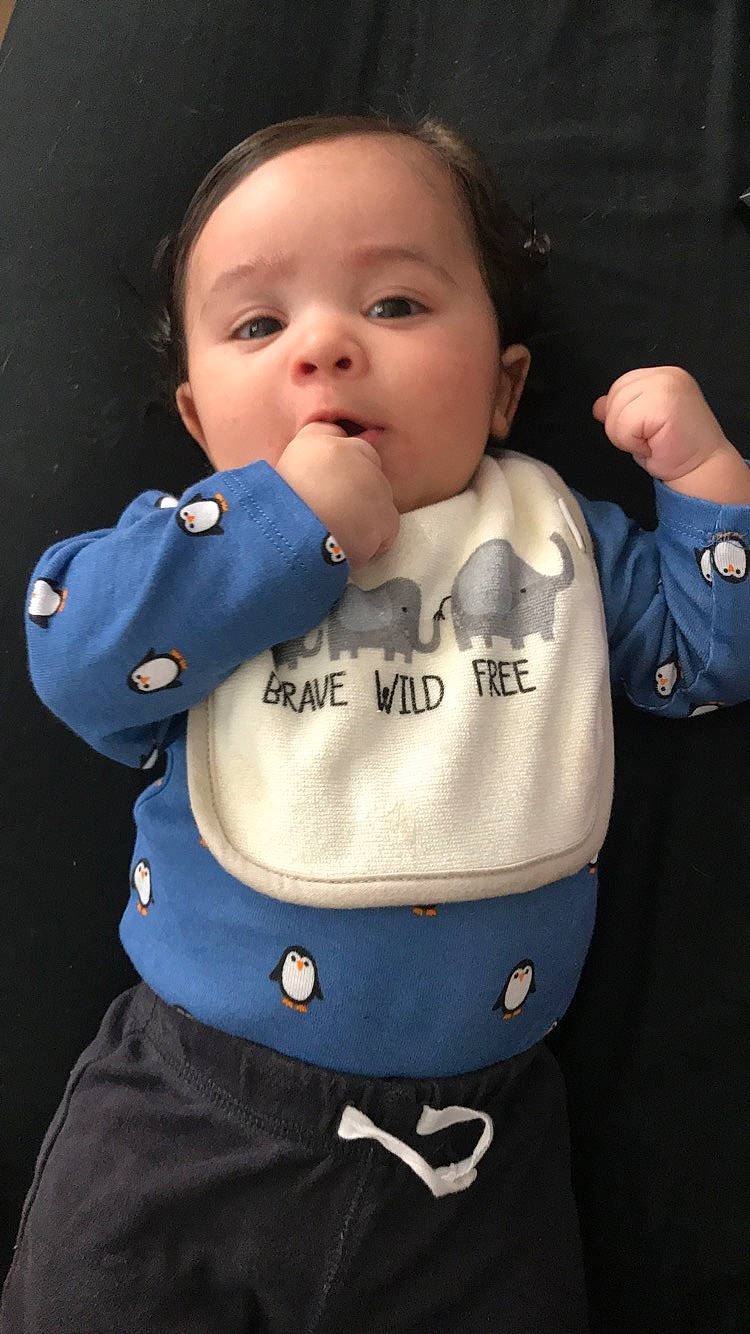 Tristian is registered to the contest to win money with this photo: baby_products, cheek, child, cool, head, infant, outerwear, person, product, textile, toddler