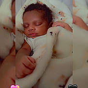 Brian is registered to the contest to win money with this photo: baby, sleeping, blanket, infant, curly_hair, peaceful, cozy, closeup, soft_texture, indoors, heart_emoji, blue_hearts, pink_hearts, black_hearts, wrapped, cute, resting, child, portrait, adorable