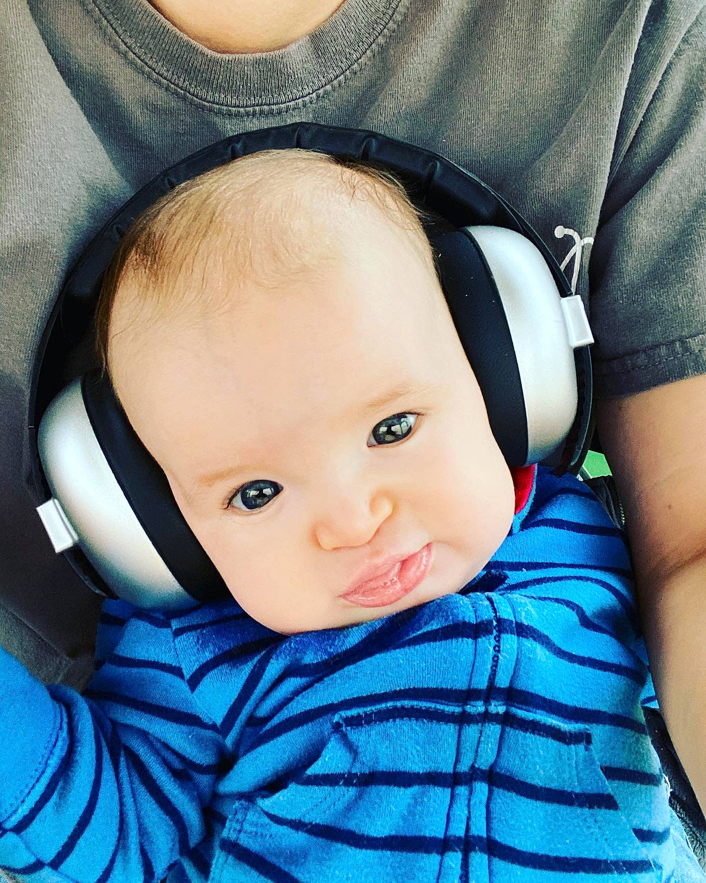 Calum is registered to the contest to win money with this photo: azure, baby, baby_toddler_clothing, black_hair, cheek, child, close_up, comfort, cool, electric_blue, eye, eyebrow, eyelash, flash_photography, happy, hat, iris, person, skin, sleeve