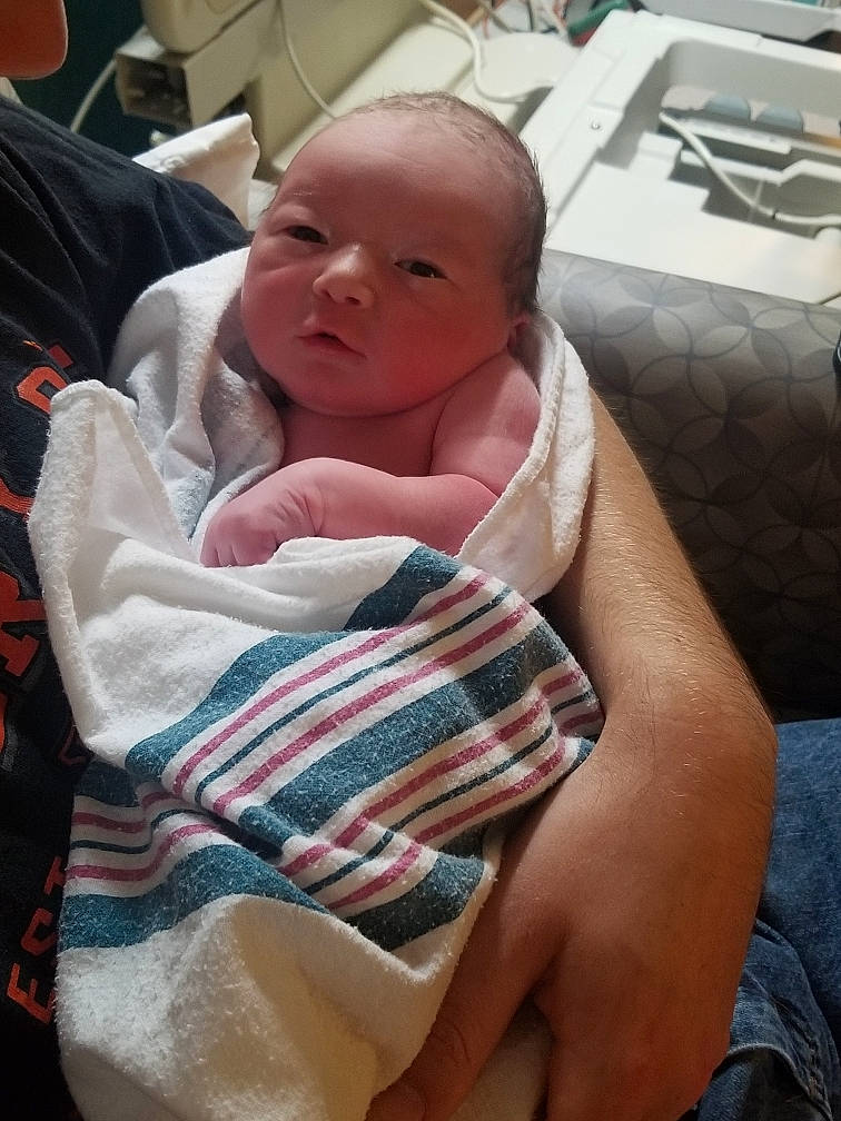 Grayso is registered to the contest to win money with this photo: abdomen, baby, baby_products, cheek, chest, child, comfort, elbow, event, hospital, human_leg, linens, mouth, neck, person, room, sitting, skin, thigh, toddler