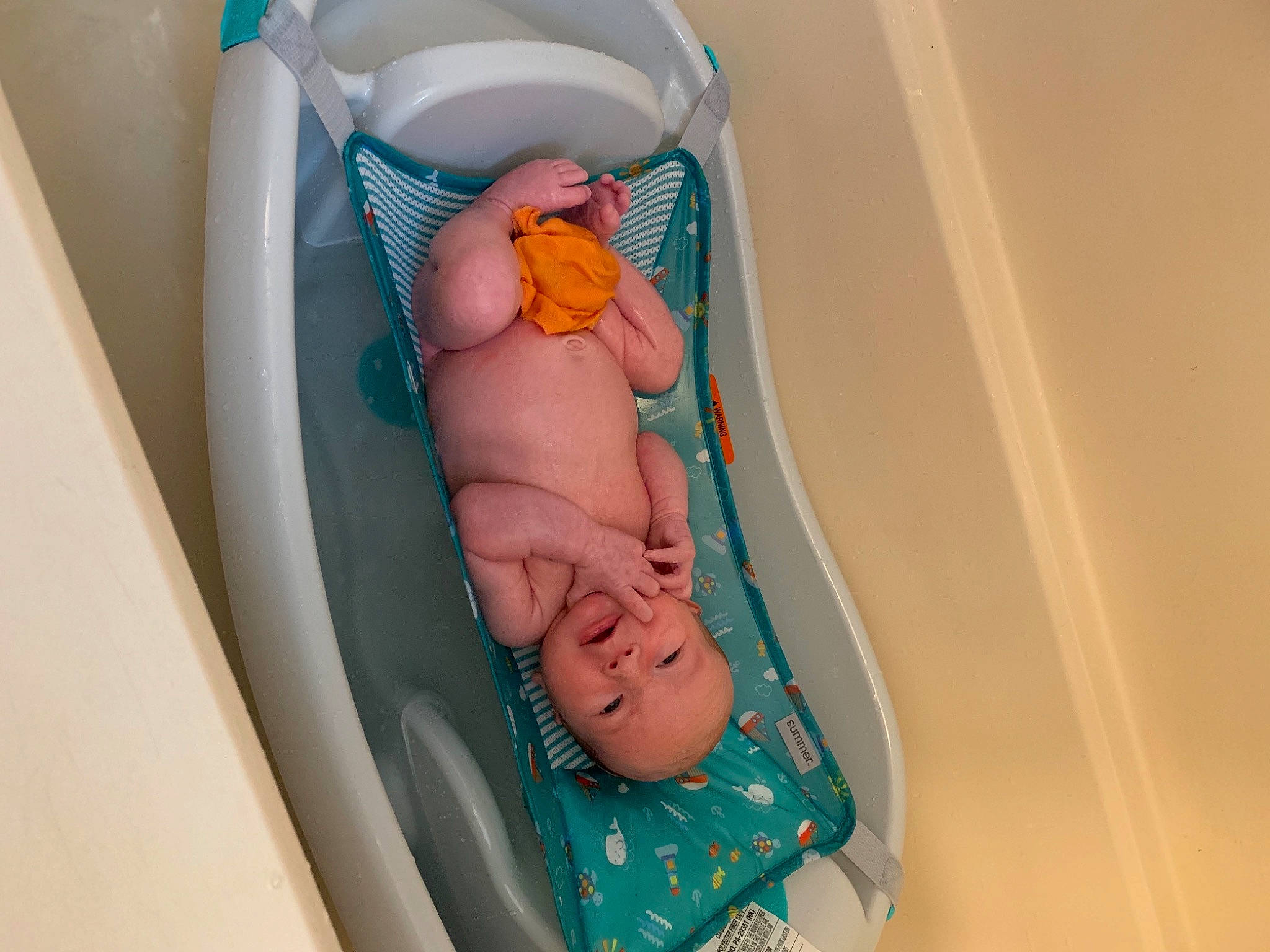 Grayso is registered to the contest to win money with this photo: baby_products, baby_toddler_clothing, baby_toys, child, comfort, foot, human_leg, leg, linens, peach, person, plastic, room, sandal, sock, toddler