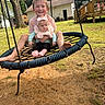 child, baby, swing, outdoor, grass, tree, house, smile, play, fun, daylight, rope, foot, headband, clothing, person, yard, nature, happy, toddler