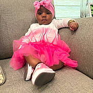 Azira joined the competition — help win amazing prizes! baby, infant, toddler, pink_tutu, headwrap, couch, bracelet, shoe, indoor, portrait, tulle, dress, sitting, cute, child, fabric, window, home, feet, relaxed