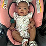 Dazaiah joined the competition — help win amazing prizes! baby, car_interior, car_seat, child, clothing, curious, cute, footwear, headband, hello_kitty, indoors, infant, outfit, pacifier, pink, portrait, safety_warning, sandals, seated, smiling