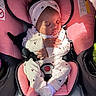 baby, car_seat, child, clothing, cute, footwear, hands, headband, indoor, infant, onesie, peaceful, pink, portrait, resting, seatbelt, shadow, sleeping, soft, sunlight